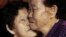 South Korean Lee Chun Hwa, right, gets a kiss from her North Korean sister Lee Chun Son before returning home after a separated family reunion meeting at the Diamond Mountain resort in North Korea, Feb. 22, 2014.