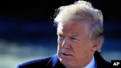 President Donald Trump walks on the South Lawn as he leaves the White House in Washington, Jan. 5, 2018, en route to Camp David, Md., to participate in a Republican leadership retreat.