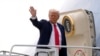 US President Donald Trump waves as he boards Air Force One en route to Florida at Harry Reid International Airport in Las Vegas, Jan. 25, 2025. 