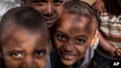 Children displaced by the conflict now live with their families at an elementary school in the town of Abi Adi, in the Tigray region of northern Ethiopia, May 11, 2021. 