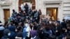 French high school students block the access to the Lycee Turgot high school in Paris during a nationwide day of strike and protests against French government's pension reform plan in France, Jan. 31, 2023. 