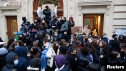 French high school students block the access to the Lycee Turgot high school in Paris during a nationwide day of strike and protests against French government's pension reform plan in France, Jan. 31, 2023. 