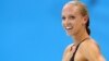 Dana Vollmer of the U.S. reacts after winning the women's 100m butterfly final during the London 2012 Olympic Games at the Aquatics Centre July 29, 2012. Vollmer set a world record with a timing of 55.98 seconds.