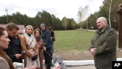 Belarusian President Alexander Lukashenko talks with reporters during his visit to the Polesie State Radioecological Reserve, Belarus, April 24, 2021.