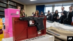 FILE - A ghost gun that police seized from an organized shoplifting crime ring is on display during a news conference at the Queens District Attorney's office in New York City, on November 26, 2024. 