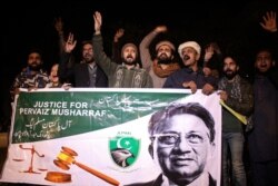 Supporters of former Pakistani military ruler Gen. Pervez Musharraf protest a court's decision, in Hyderabad, Pakistan, Dec. 17, 2019.