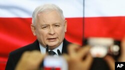 Leader of Poland's ruling party Jaroslaw Kaczynski speaks in reaction to exit poll results right after voting closed in the nation's parliamentary election that is seen crucial for the nation's course in the next four years, in Warsaw , Poland, Oct. 13, 2