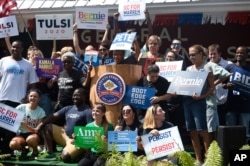 Supporters of several of the Democratic presidential candidates gather for a photo ahead of the Galivants Ferry Stump, Sept. 16, 2019, in Galivants Ferry, South Carolina.