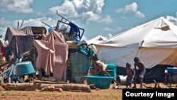 A pile of personal property left in the open at the Chingwizi transit camp. Hundreds of families lost their property during their relocation to the camp. (Photo: Human Rights Watch)