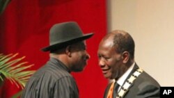Ivory Coast President Alassane Ouattara (R) is greeted by Nigeria's President Goodluck Jonathan during his inauguration ceremony at the Felix Houphouet-Boigny Foundation in Yamoussoukro, May 21, 2011