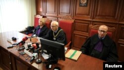 Judges of court of appeal upheld a landmark ruling granting a million zloty ($268,000) in compensation to a victim of sexual abuse by a Catholic priest in Poznan, Poland, Oct. 2, 2018.