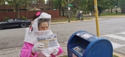 Beatrice Lumpkin, 102-year-old former teacher, casts her vote-by-mail ballot in Chicago, Oct. 1, 2020, in this picture obtained from social media. (Soren Kyale - Chicago Teachers Union)