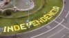 FILE - The word 'Independencia' (independence) is seen on a roundabout before a rally dedicated to Catalonia's National Day, in Barcelona, Spain, Sept. 11, 2019. 