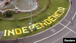 FILE - The word 'Independencia' (independence) is seen on a roundabout before a rally dedicated to Catalonia's National Day, in Barcelona, Spain, Sept. 11, 2019. 