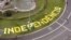 FILE - The word 'Independencia' (independence) is seen on a roundabout before a rally dedicated to Catalonia's National Day, in Barcelona, Spain, Sept. 11, 2019. 