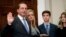 Health and Human Services Secretary Alex Azar, left, accompanied by his family, is sworn in during a ceremony in the Roosevelt Room at the White House, Jan. 29, 2018, in Washington.