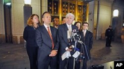 Attorneys Peter Quijano (R) and Steve Zissou address the media after their client, Ahmed Ghailani, was acquitted of all but one charge accusing him of a deadly 1998 plot to bomb two U.S. embassies in Africa, 17 Nov 2010 in New York