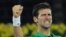 Novak Đoković proslava pobedu nad Stefanosom u finalu turnira u Dubaiju, 29. februara 2020. (AP Photo/Kamran Jebreili)
