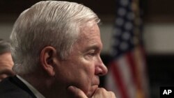 US Secretary of Defense Robert Gates listens to remarks at a Senate Armed Services Committee hearing on the "Defense Authorization Request for FY2012" in Washington, Feb. 17, 2011.