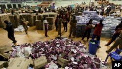 Volunteers sort relief material to be distributed to flood victims in Chennai, India, Dec. 6, 2015. The worst flooding in a century in Tamil Nadu has left scores of people dead since November. 