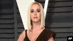 FILE - Katy Perry arrives at the Vanity Fair Oscar Party in Beverly Hills, California, Feb. 26, 2017. Perry opened up about having suicidal thoughts during a marathon weekend livestream event.