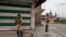 Indian paramilitary soldiers stand guard at a market in Srinagar, Indian-controlled Kashmir, July 13, 2019.