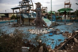 A theme-pool lays in ruins at an abandoned amusement park coined "Diversions Grano de Oro" in Maracaibo, Venezuela, May 23, 2019.