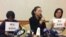 台湾人权工作者李明哲之妻李净瑜(中)(美国之音申华拍摄)