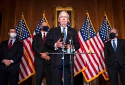 Senate Majority Leader Mitch McConnell of Kentucky speaks to the media after the Republican's weekly Senate luncheon, at the Capitol in Washington, Dec. 8, 2020.