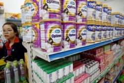 FILE - Vinamilk's products are displayed for sale at a shop in Hanoi, Vietnam, Aug. 4, 2017.
