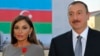 FILE - Azerbaijan's President Ilham Aliev (R) and first lady Mehriban Aliyeva pose after she was awarded with the Legion d'Honneur medal in Baku.