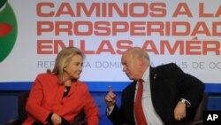 Secretary of State Hillary Rodham Clinton, left, talks to Secretary General of the Organization of American States Jos Miguel Insulza during a ministerial-level meeting of Pathways to Prosperity in the Americas, in Santo Domingo, Wednesday Oct. 5, 2011. (