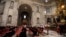 Cardinals pray at Saint Peter's Basilica in the Vatican, March 6, 2013.