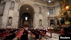 Cardinals pray at Saint Peter's Basilica in the Vatican, March 6, 2013.