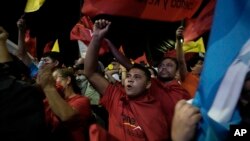 Supporters of Free Party presidential candidate Xiomara Castro cheer before she speaks after general elections, in Tegucigalpa, Honduras, Nov. 28, 2021.