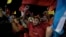 Supporters of Free Party presidential candidate Xiomara Castro cheer before she speaks after general elections, in Tegucigalpa, Honduras, Nov. 28, 2021.
