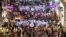 People walk along a main shopping street of Istiklal in Istanbul, Turkey, July 11, 2012. 