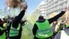 Des manifestants scandent des slogans et des gestes lors d'une manifestation antigouvernementale appelée par le mouvement des Gilets jaunes "Gilets Jaunes" à Nice, dans le sud de la France, le 12 janvier 2019. (VALERY HACHE / AFP)