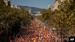 Pro-Spain demonstrators gather a long a street during a protest called by a unionist Catalan civil society group in Barcelona, Spain, Oct. 27, 2019. 