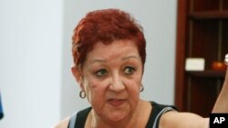 FILE - Norma McCorvey, the plaintiff in the landmark lawsuit Roe v. Wade, participates with other anti-abortion demonstrators in discussions inside then-House Speaker Nancy Pelosi's office on Capitol Hill in Washington, July 28, 2009.