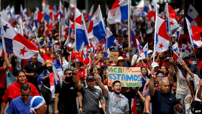 People protest during a march against the government contract with Canadian mining company First Quantum and its subsidiary Minera Panama in Panama City on November 3, 2023.