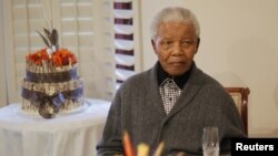 Former South African president Nelson Mandela observes his 94th birthday at his house in Qunu, Eastern Cape, July 18, 2012.