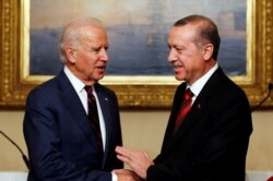 FILE - Then-US. Vice President Joe Biden (L) meets with Turkey's President Tayyip Erdogan in Istanbul, Nov. 22, 2014.