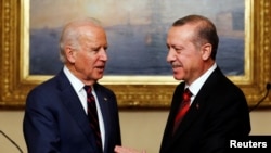 FILE - Then U.S. Vice President Joe Biden (L) meets with Turkey's President Tayyip Erdogan in Istanbul.