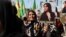 Women protest over the death of Mahsa Amini in Iran, in the Kurdish-controlled city of Qamishli