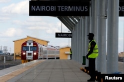FILE - A train launched to operate on the Standard Gauge Railway line constructed by the China Road and Bridge Corporation and financed by Chinese government arrives at the Nairobi Terminus on the outskirts of Kenya's capital Nairobi, May 31, 2017.