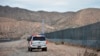 FILE - A U.S. Border Patrol agent patrols Sunland Park along the U.S.-Mexico border next to Ciudad Juarez, Jan. 4, 2016.