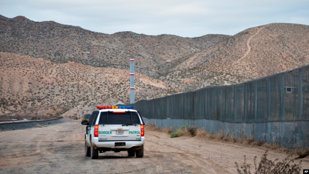 FILE - A U.S. Border Patrol agent patrols Sunland Park along the U.S.-Mexico border next to Ciudad Juarez, Jan. 4, 2016.