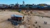 A boat is grounded in the Negro River at the port in Manaus, Amazonas state, Brazil, Oct. 4, 2024, amid severe drought.