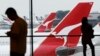 Qantas Kurangi Layanan Penerbangan 